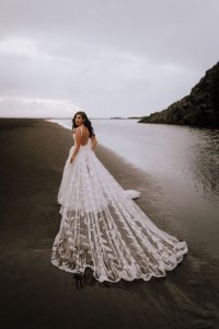 An Ivory embroidered Bespoke Wedding dress gown made with metres of tulle and a hand stitch feather lace bodice